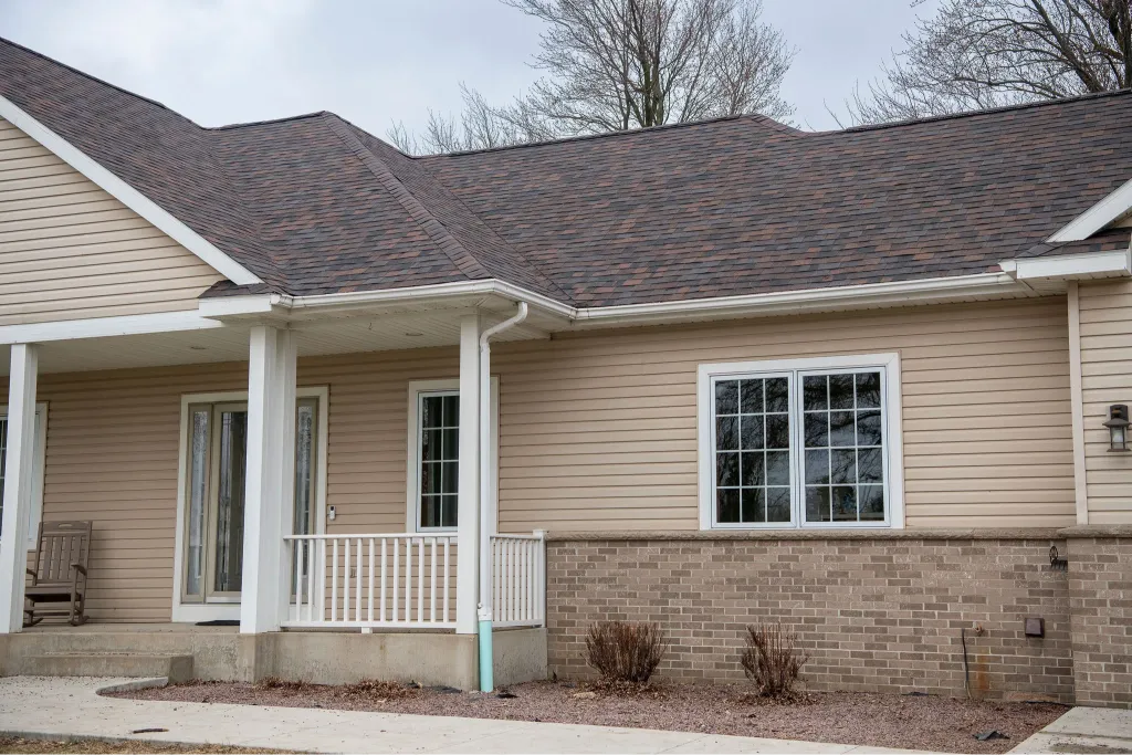Newly completed shingle roof on suburban home showcasing quality residential roofing