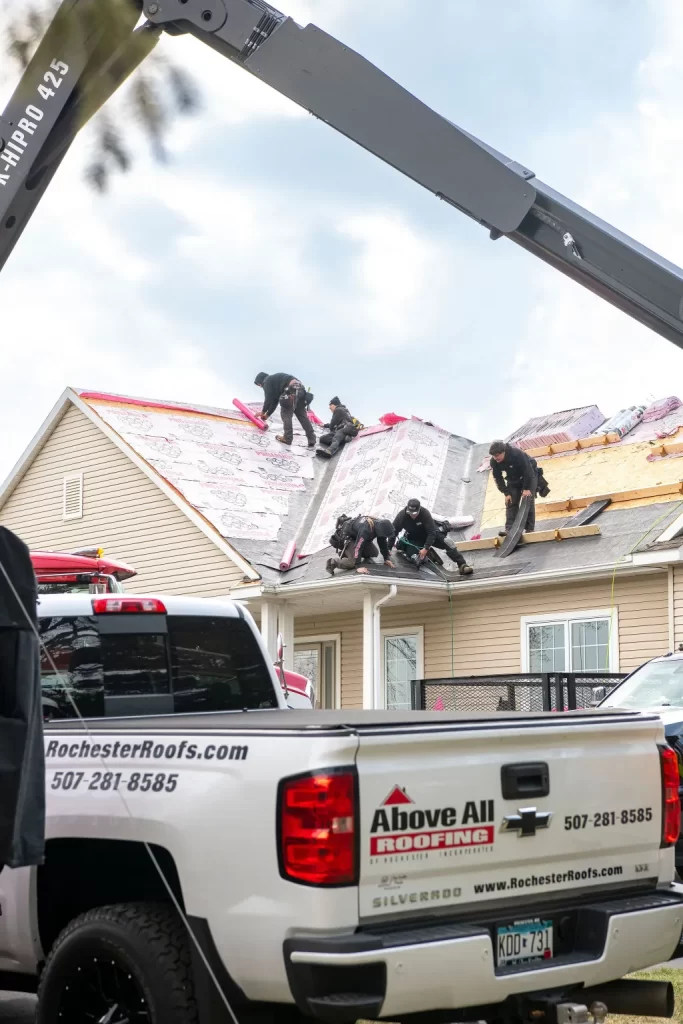 Above All Roofing team handling specialized roofing needs for uniquely designed commercial buildings in Rochester, MN
