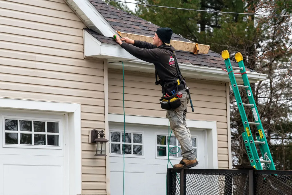 Above All Roofing team working in a Rochester residential neighborhood