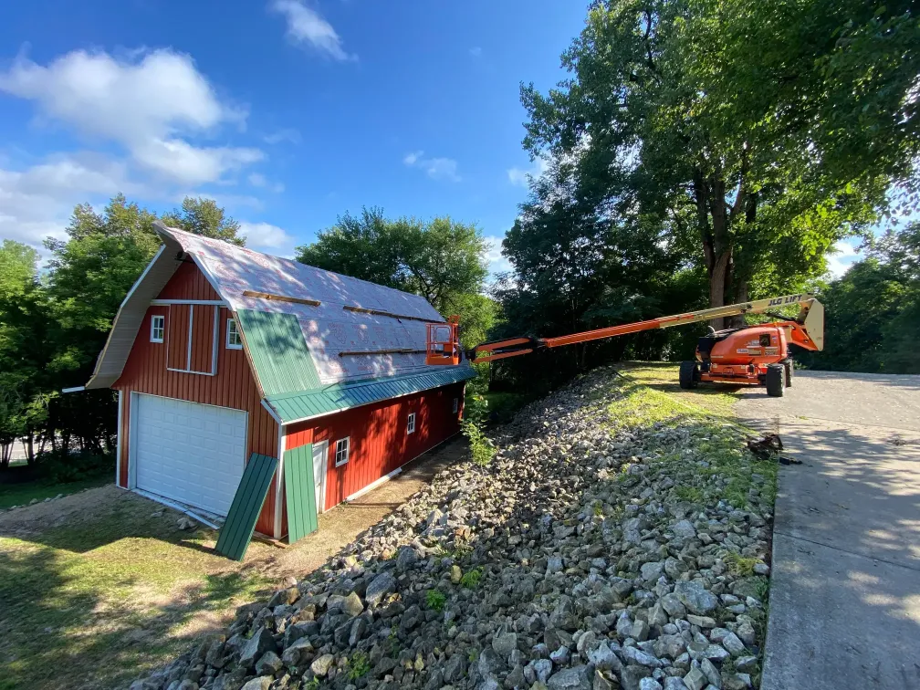 Above All Roofing team replacing an aged barn roof with durable, weather-resistant materials