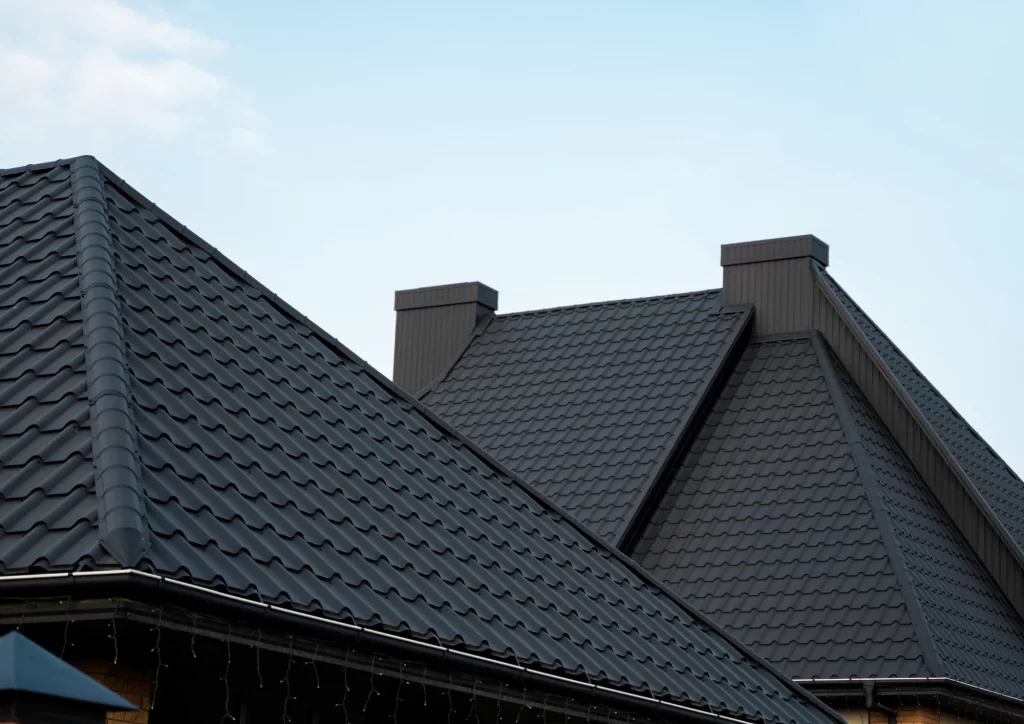 Durable black metal roof on a home built for harsh Minnesota weather by Above All Roofing